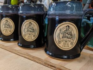 Purple and blue beer steins with "Federal Jacks" logo.