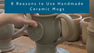 image of a person's hands putting a clay medallion on a handmade mug with the text 'reasons to use handmdae ceramic mugs' at the top