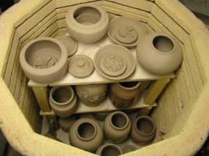 pottery kiln filled with clay pots