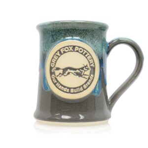 Peppercorn, our glossy, warm grey with black and white speckles, under deep, glossy turquoise rim glaze